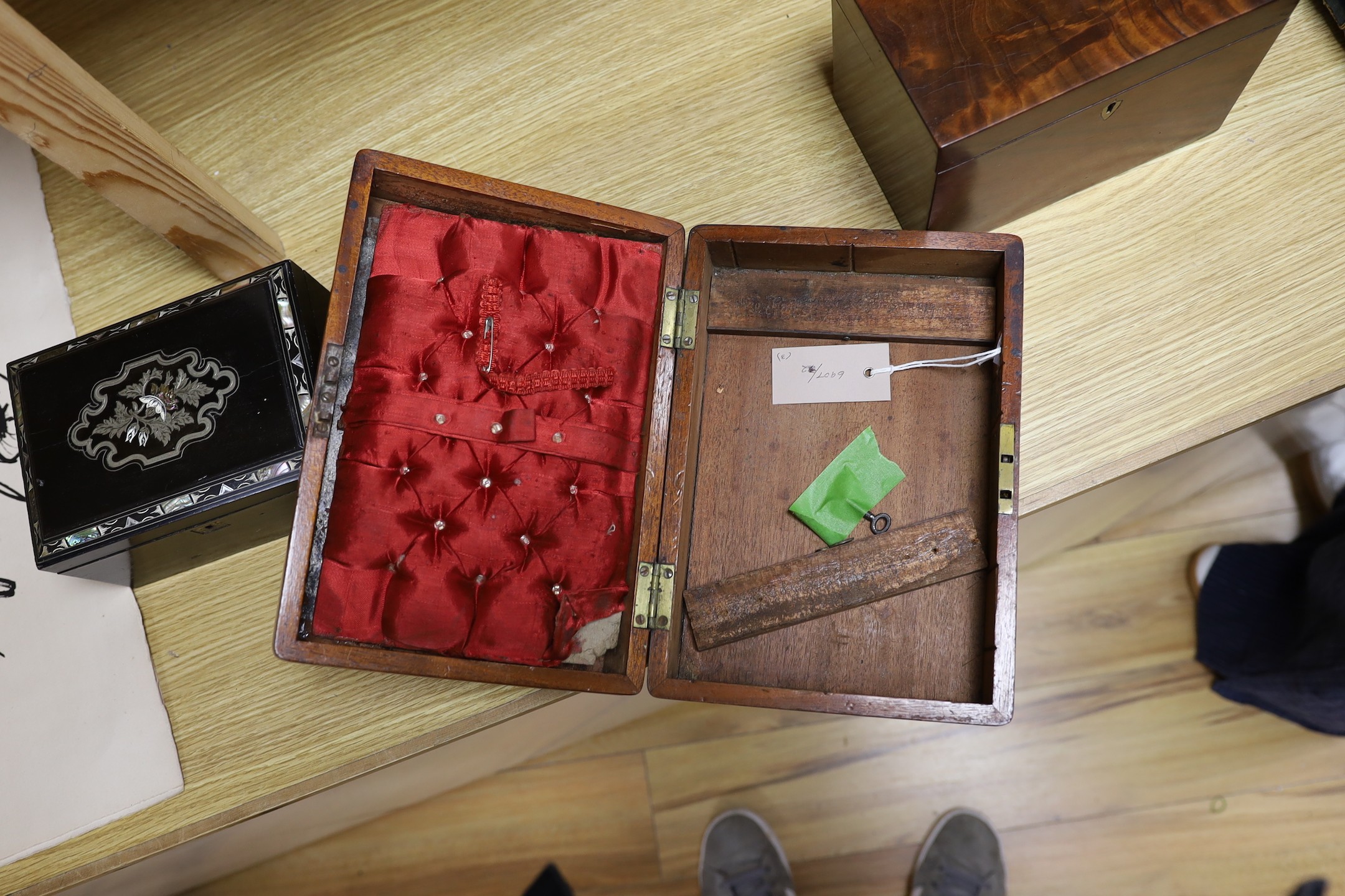 A Victorian mahogany brass bound sewing box, a mother of pearl and silver metal inlaid ebony tea caddy and another caddy, Ebony caddy 19 cms wide x 9 cms high